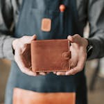 A Person Holding a Leather Wallet