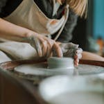 Woman Shaping a Soft Clay